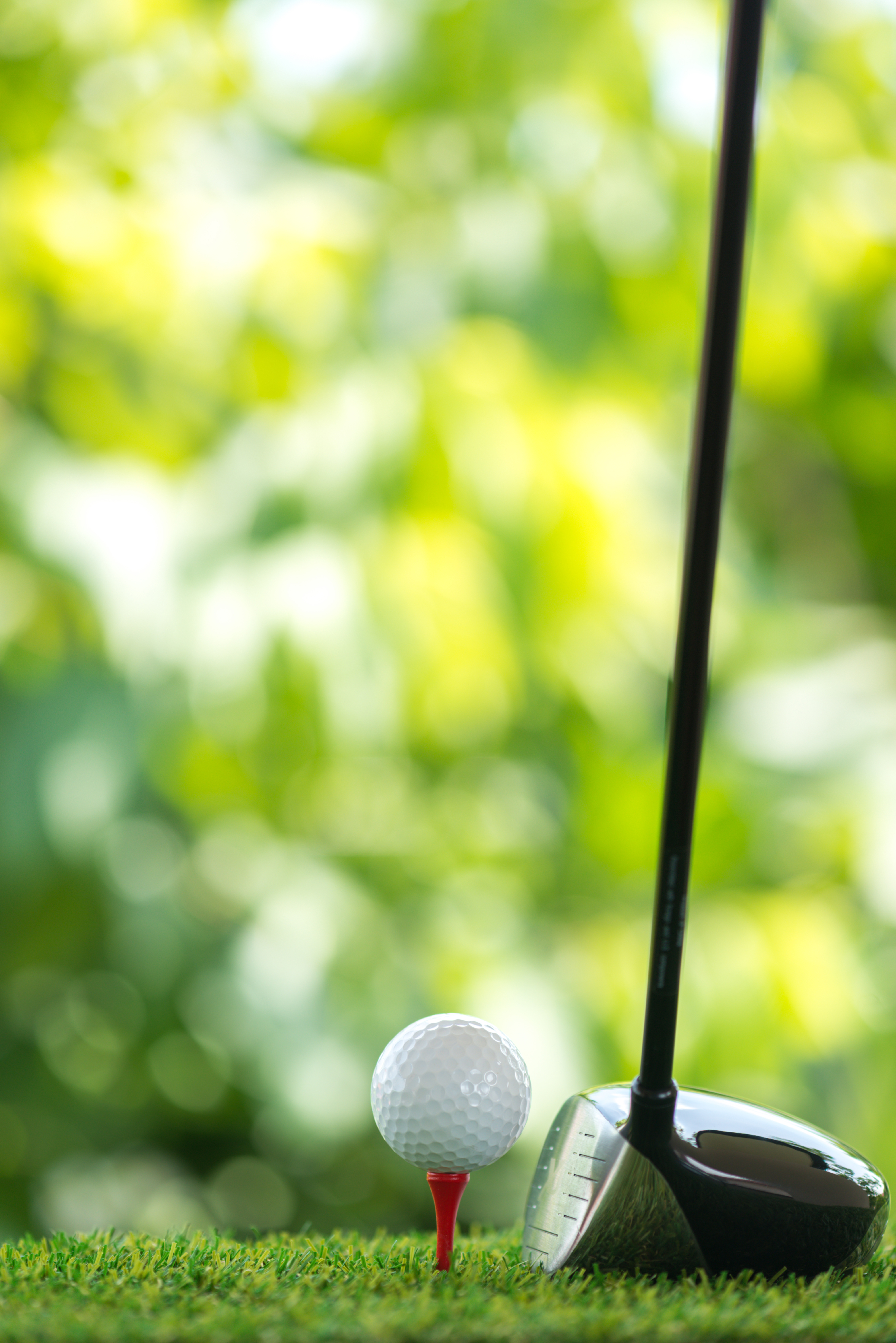 A golf ball that is about to be hit with a driver club in Clearfield, UT.