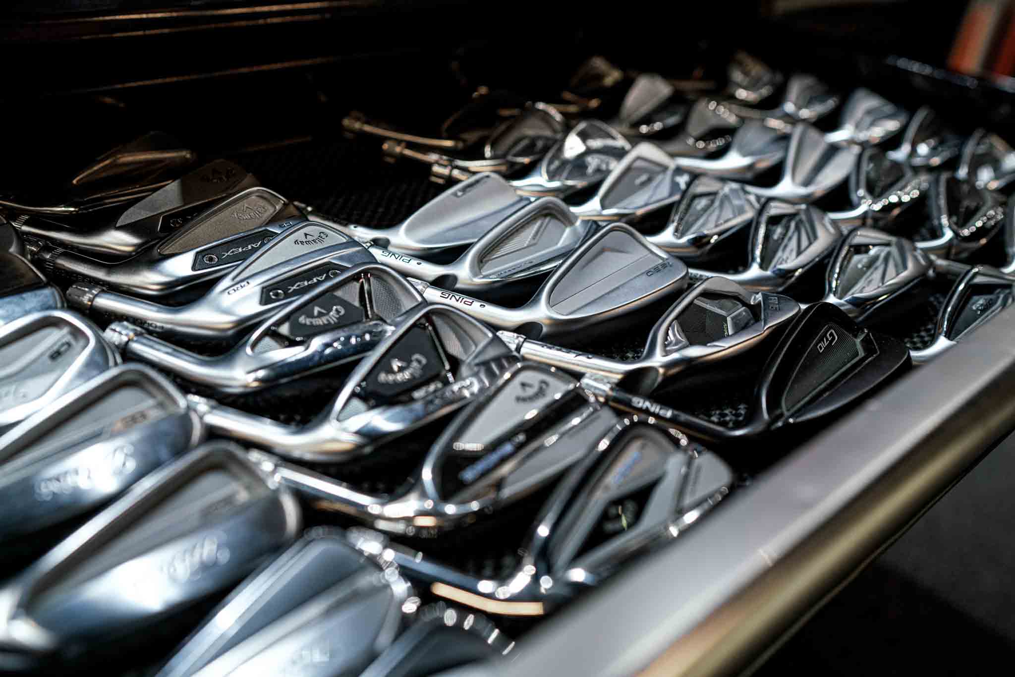 An image of a club heads and equipment at Tee Box.