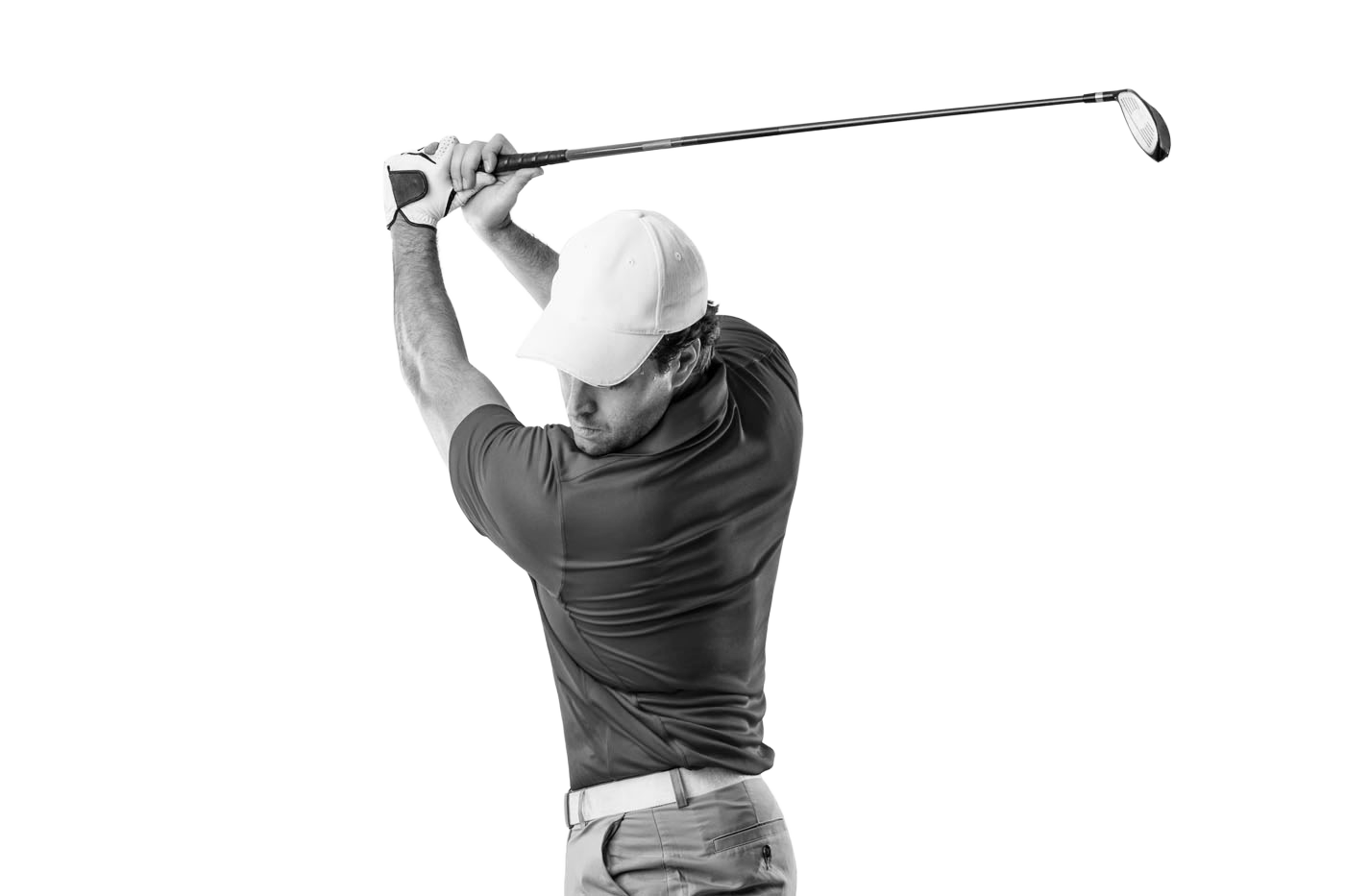 A man swinging a golf club durong golf instruction.