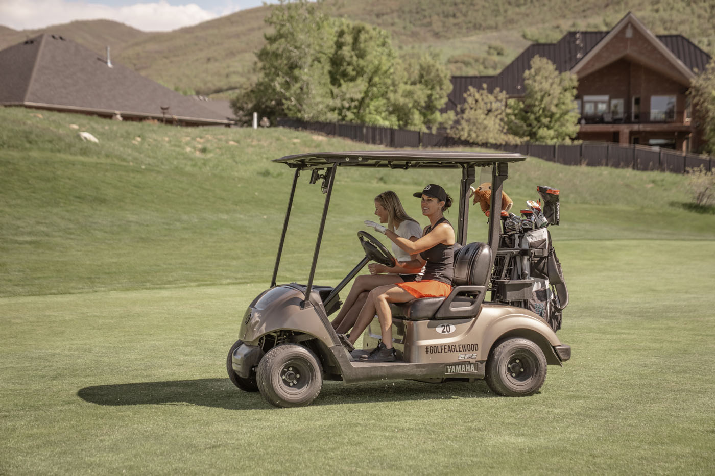 Two Tee Box golfers on an outside course.