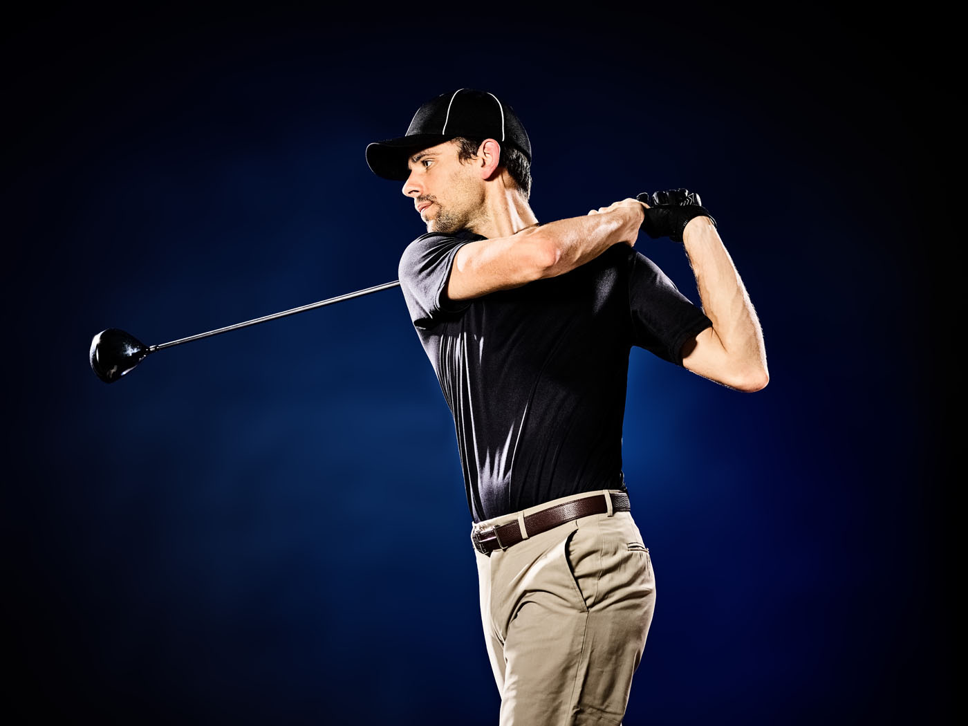 An image of a golfer hitting their club at Tee Box.