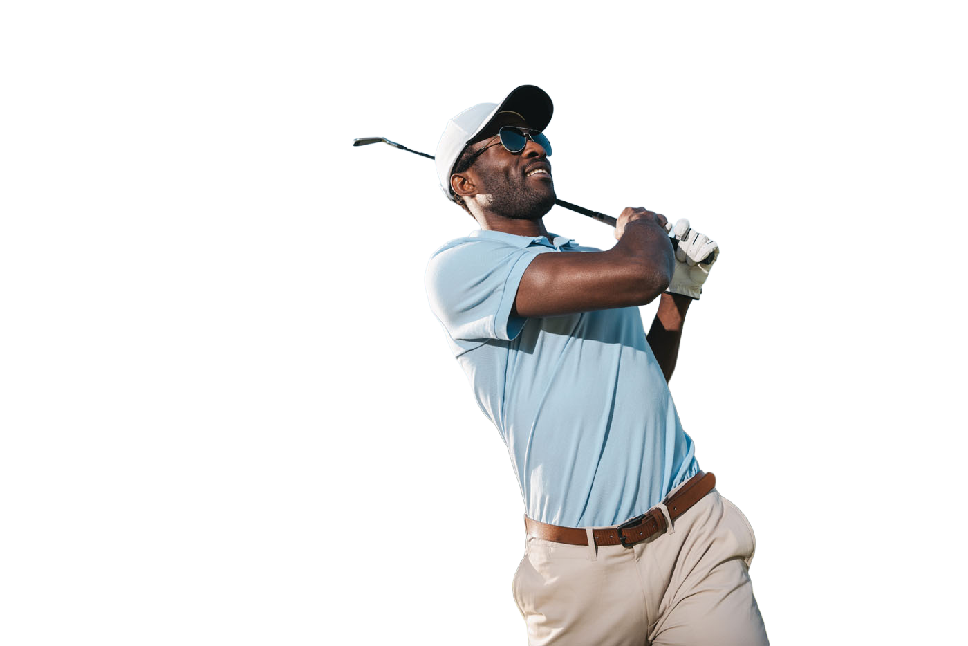 A man swinging his club while using a Tee Box indoor golf course.