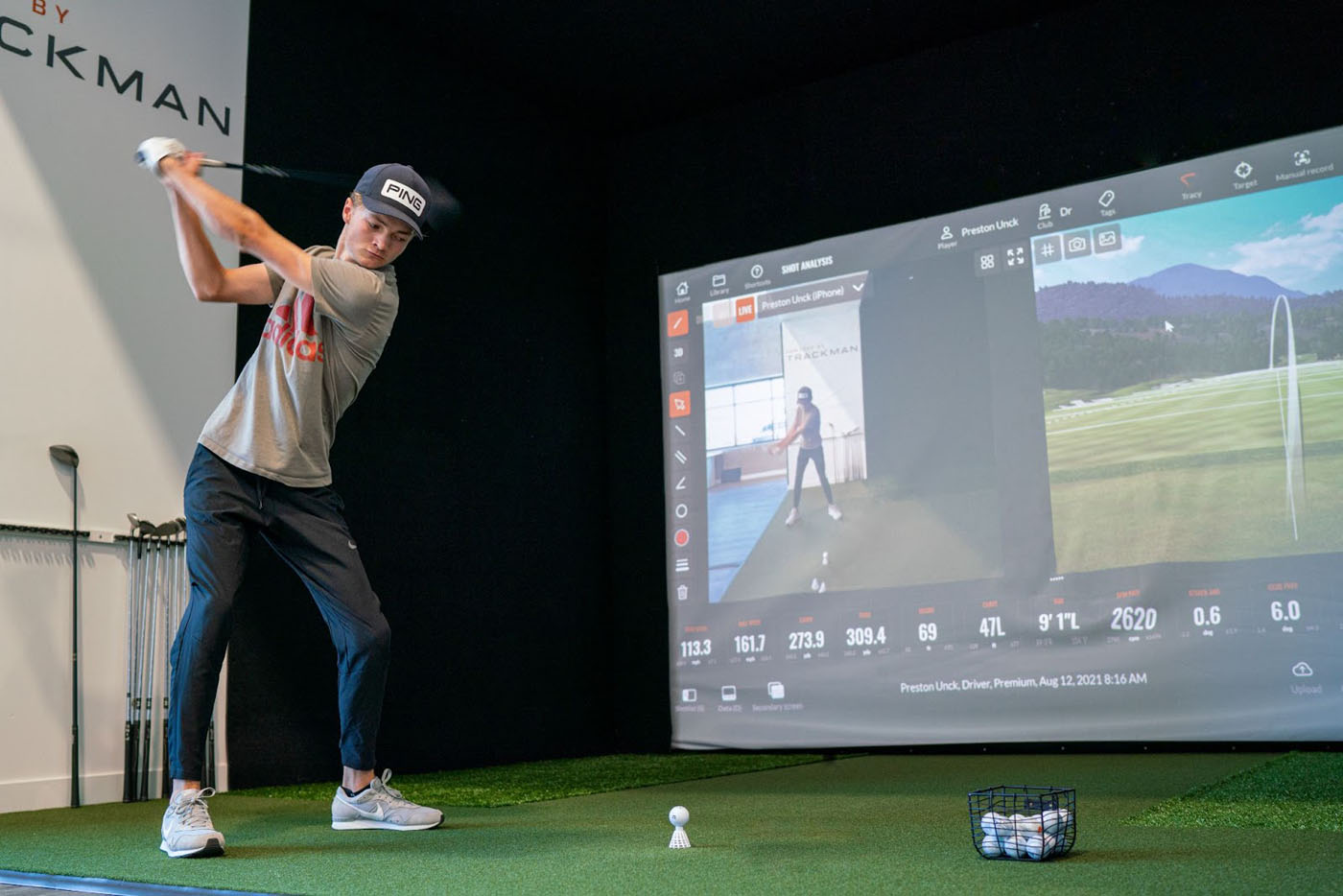 A young golfer using the trackman simulators at Tee Box.