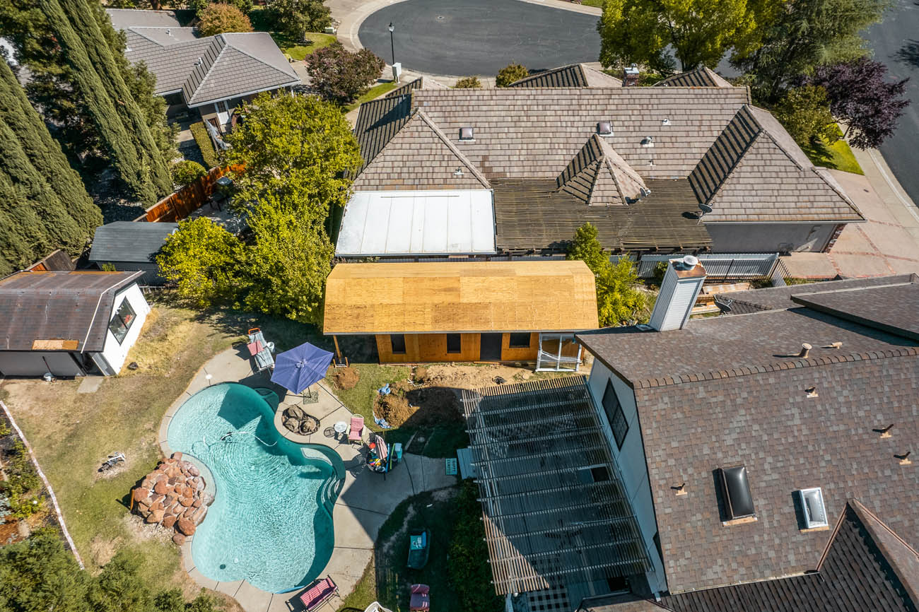 An ADU being built next to a pool by a expert pool house builder at Anchored Tiny Homes.