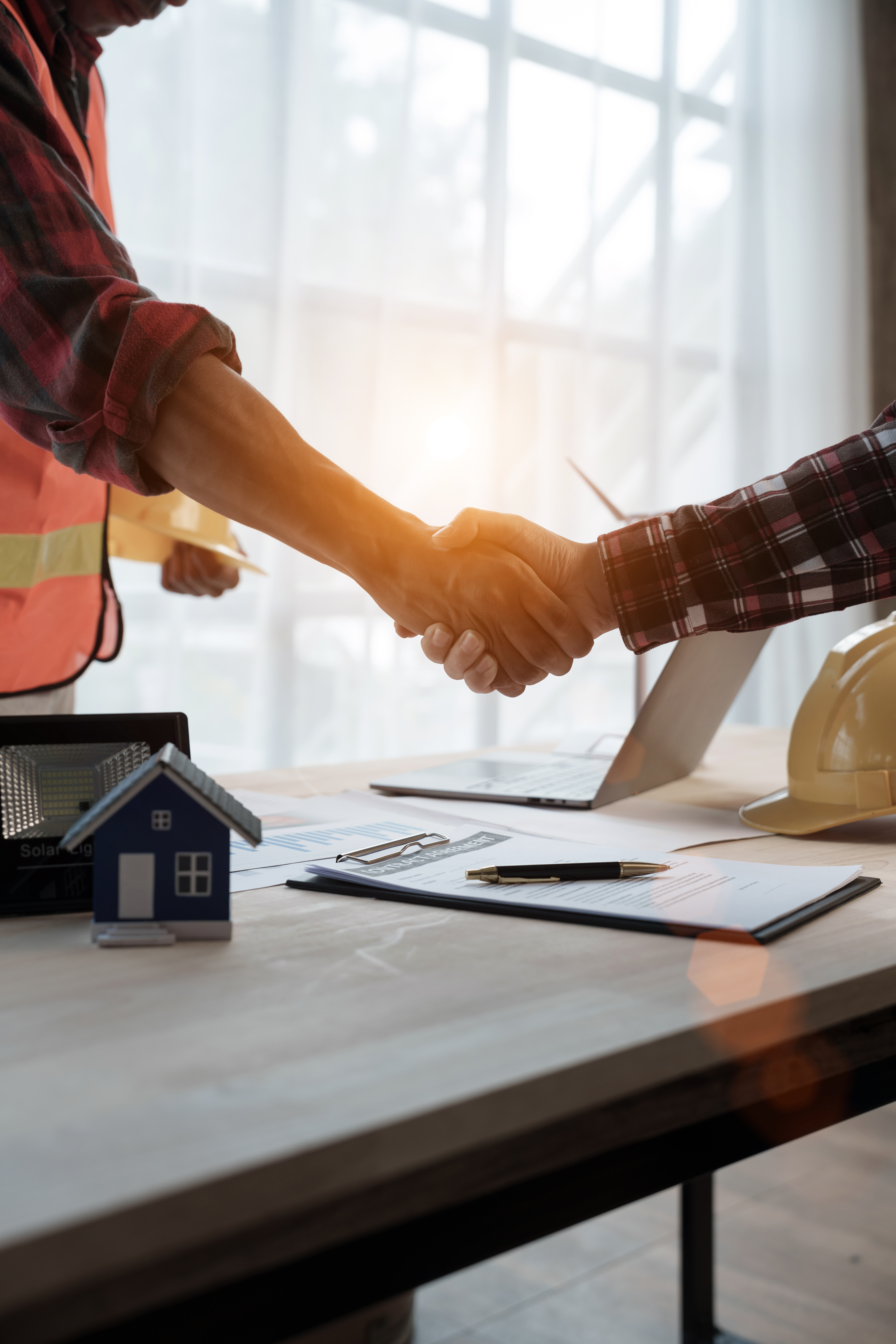 A Anchored Tiny Homes franchise owner shaking hands with their ideal client.