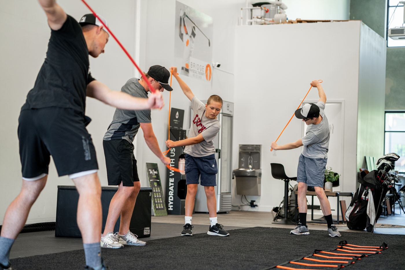 Golfers at Tee Box at golf training for beginners.