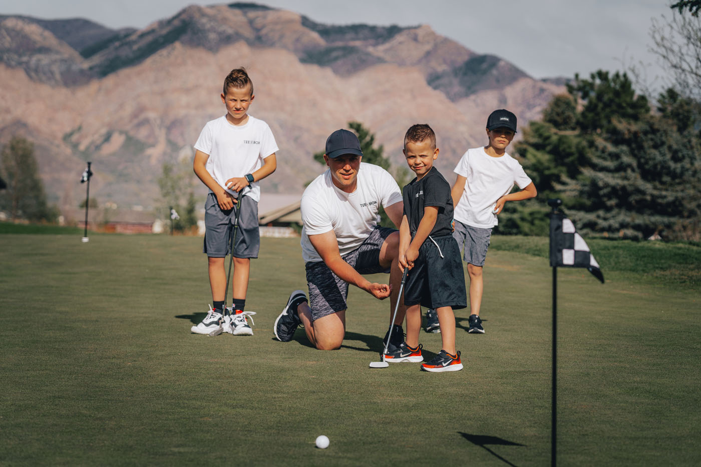 Tee Box and young kids on our outdoor golf course in Centerville, UT